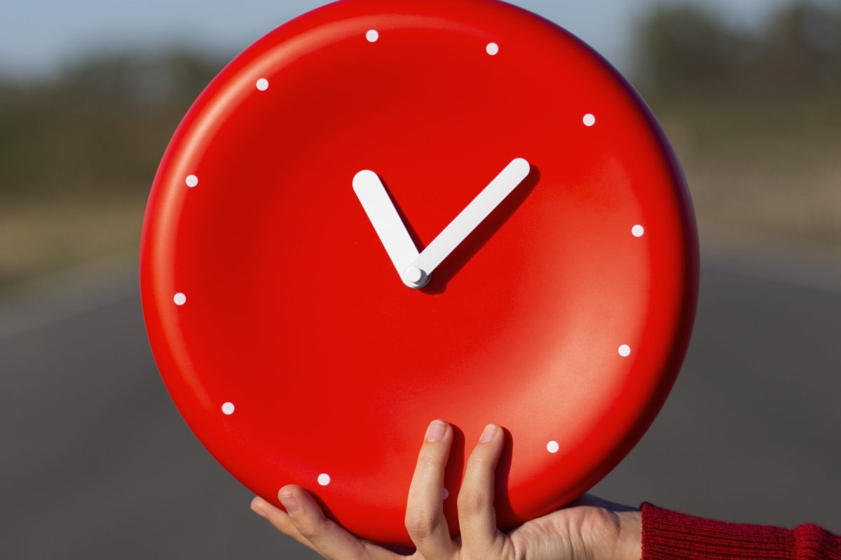 hand-holding-wall-clock-still-life